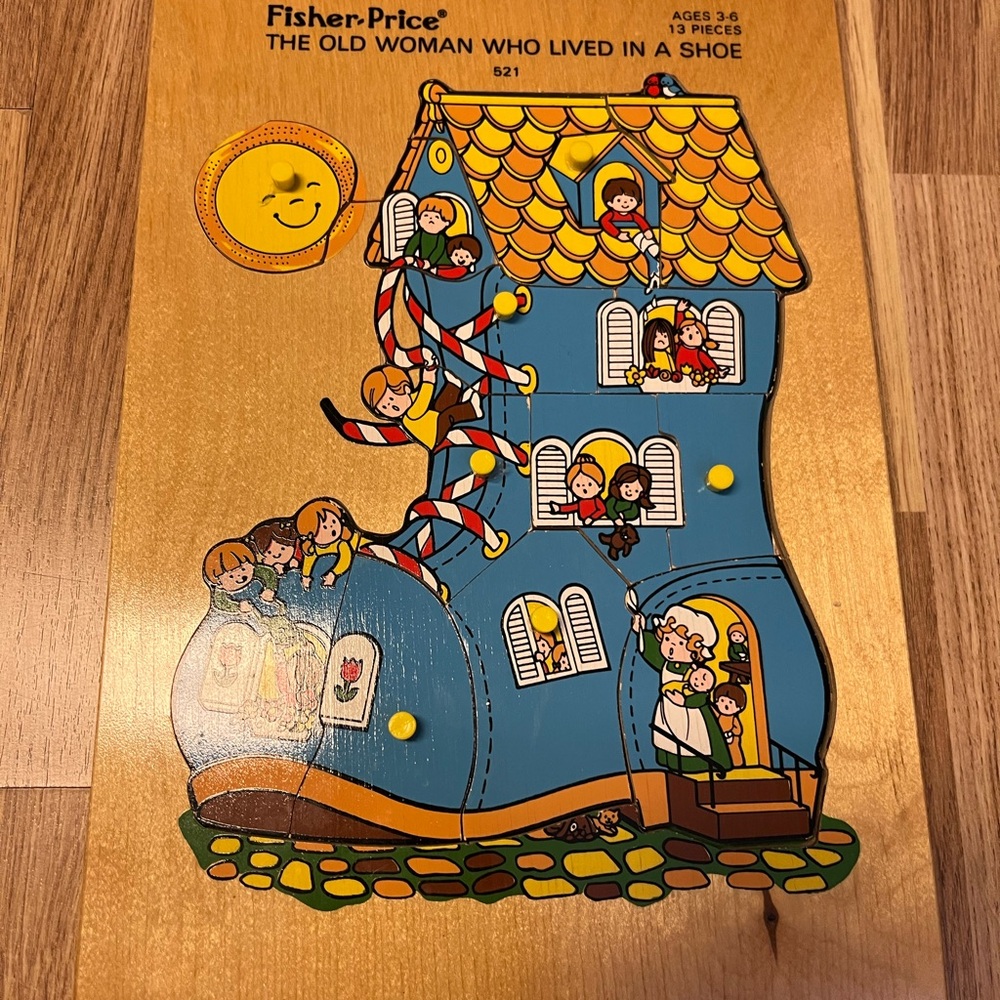 Fisher-Price Blue Shoe House Wooden Peg Puzzle with Yellow Roof
